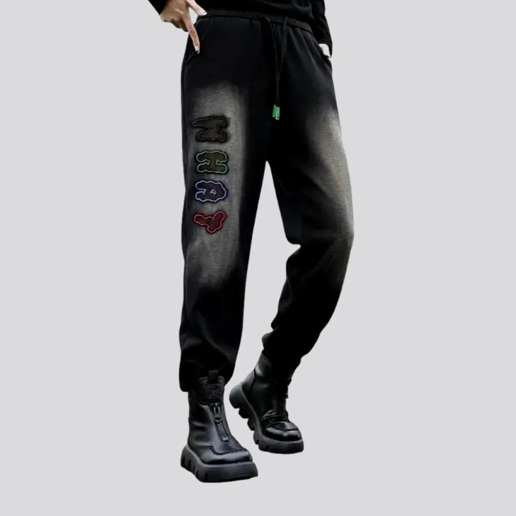 Knowledge And Elegance Inscribed jeans pants for ladies
